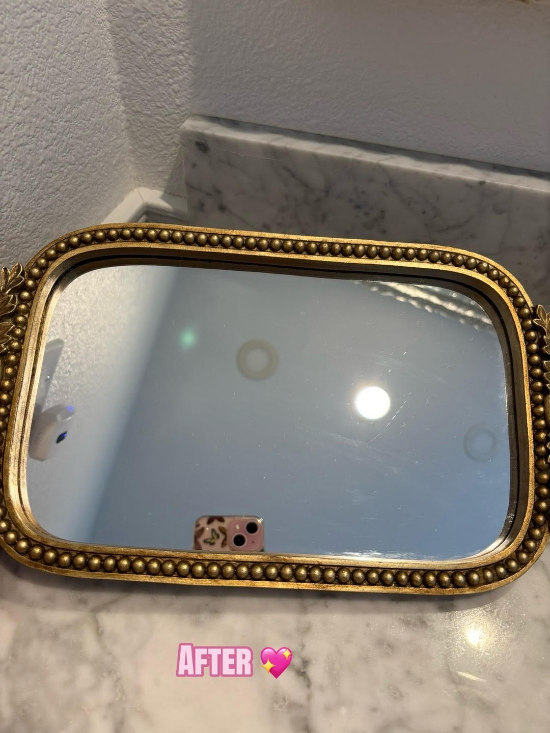 gold-framed mirror after cleaning